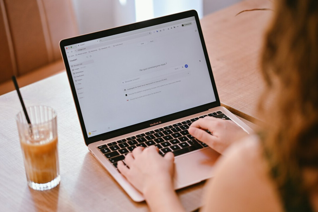 woman coding on laptop