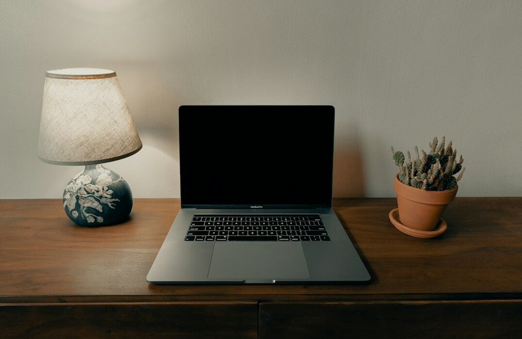 person coding at home desk